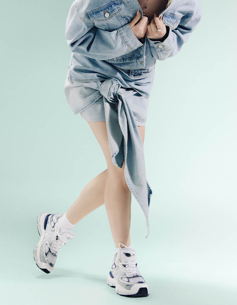 Woman wearing a denim outfit from Axel Arigato
